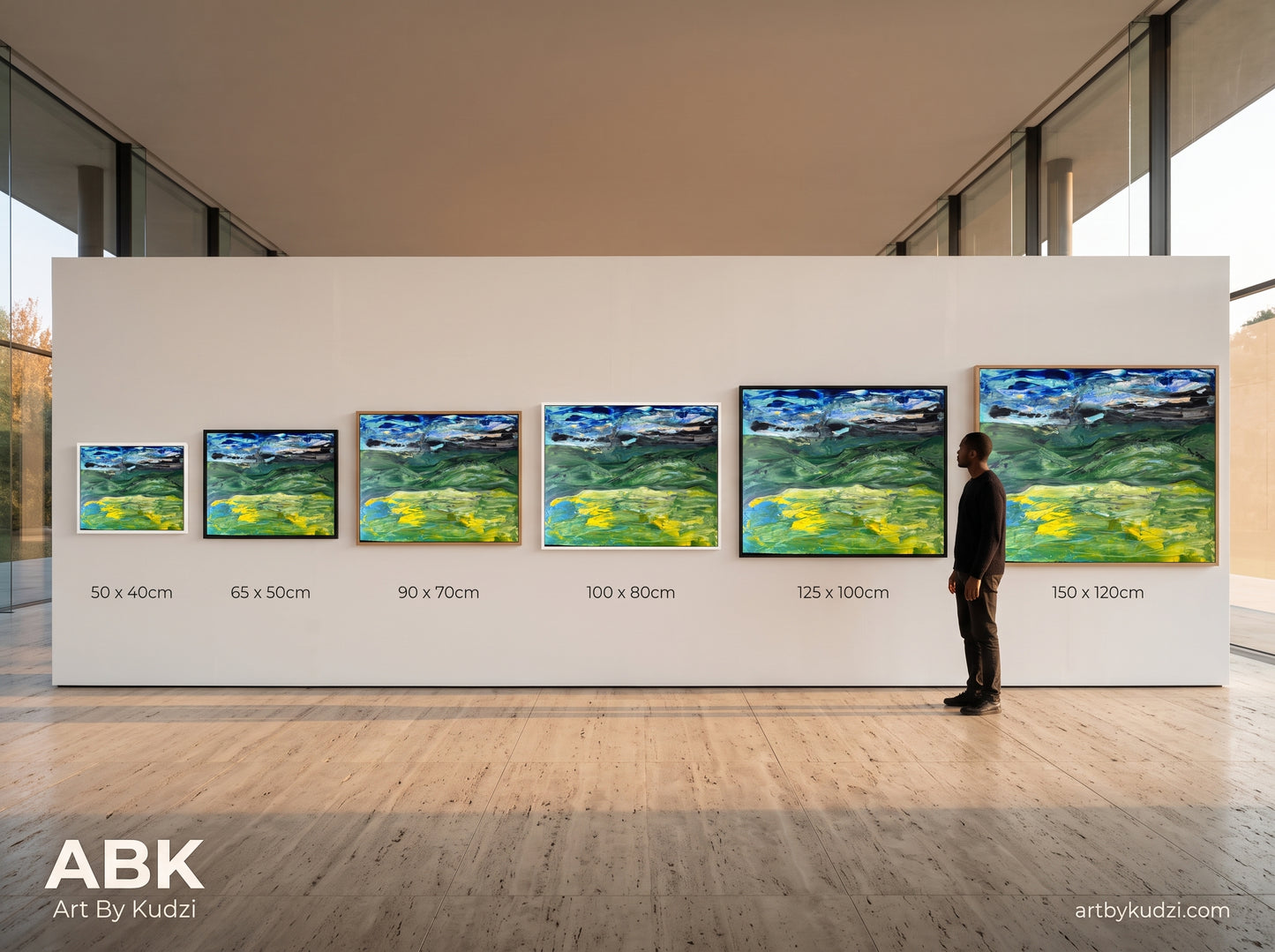 A size and frame comparison image for Abundant Rain Is Coming, showing all six available canvas print sizes from 50 x 40cm to 150 x 120cm, displayed side by side in white, black, and oak frames within a minimalist showroom setting. A person stands beside the largest print to give a clear, real world sense of scale. Created to help customers visualise the size options before choosing