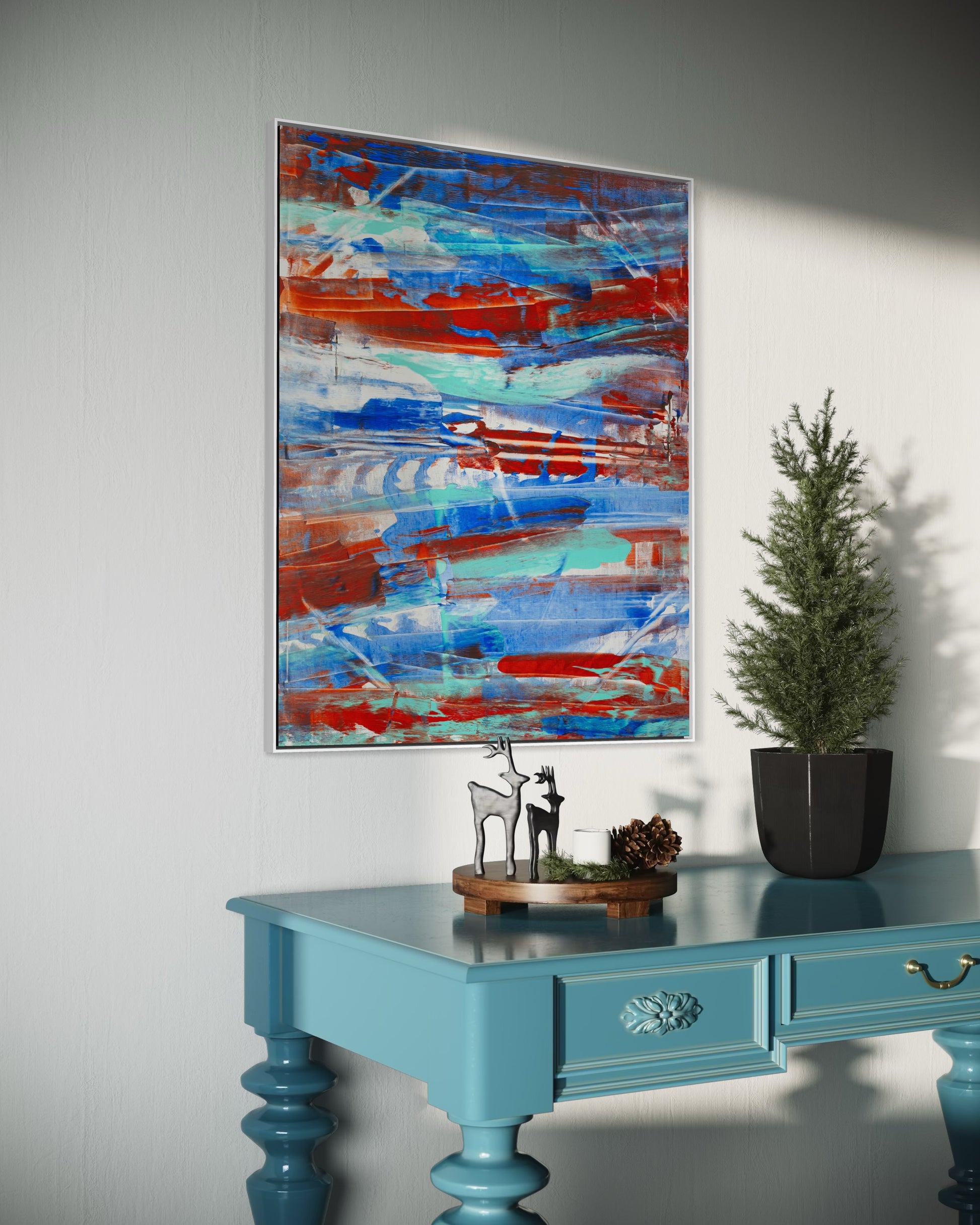 Unfinished Yet Complete canvas displayed in modern living room - Inspirational Christian wall art by Art By Kudzi. Abstract painting on a wall above a blue table with decorative items.